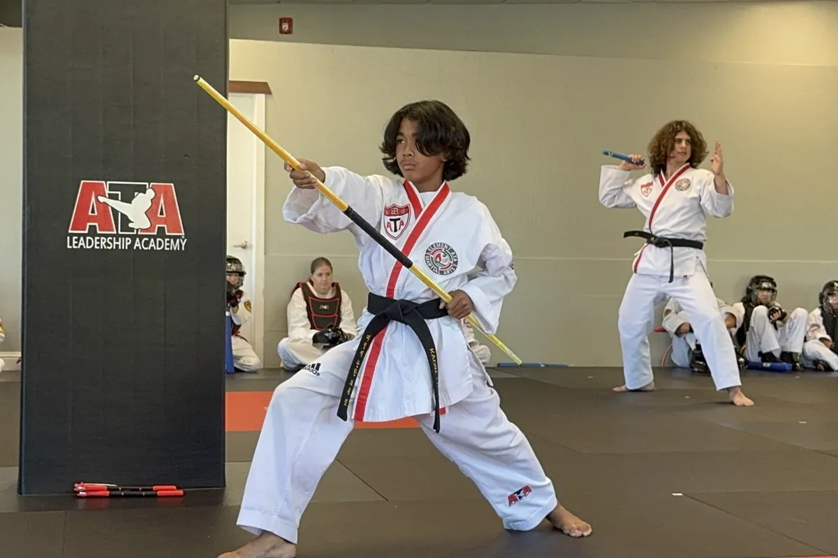 Students demonstrating weapons forms on the training floor at Element ATA Martial Arts in Martinez CA