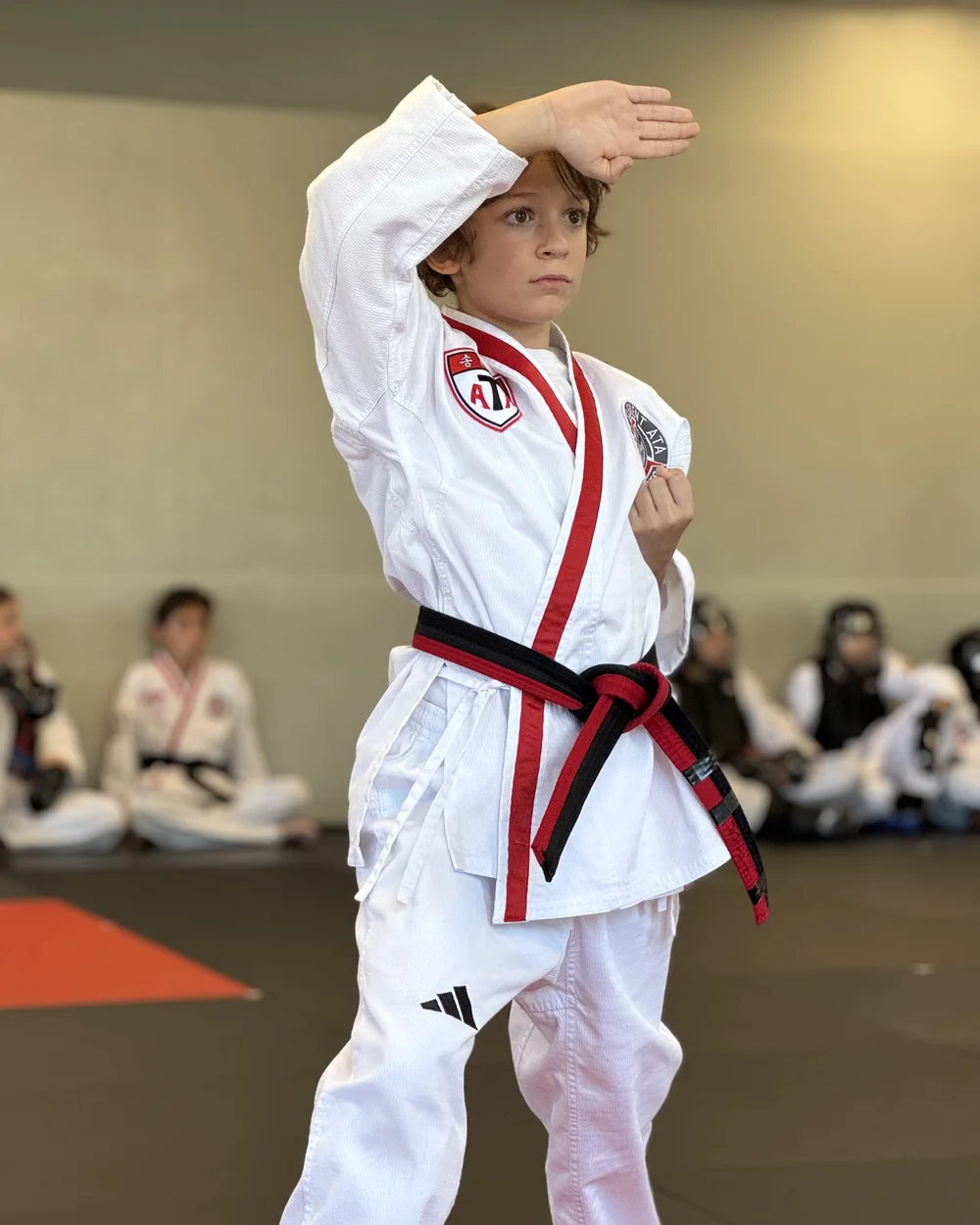 Black belt student in a red and black belt performing an advanced taekwondo form at Element ATA Martial Arts in Martinez CA